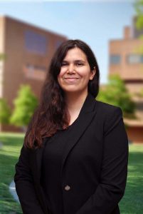 A three quarter portrait of Lorraine on the Library green.