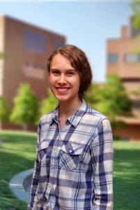 A three quarter portrait of Anna on the Library green.
