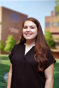 A three quarter portrait of Morgan on the Library green.