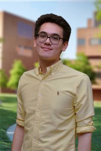 A three quarter portrait of Adam on the Library green.