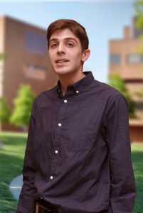 A three quarter portrait of Jeremy on the Library green.